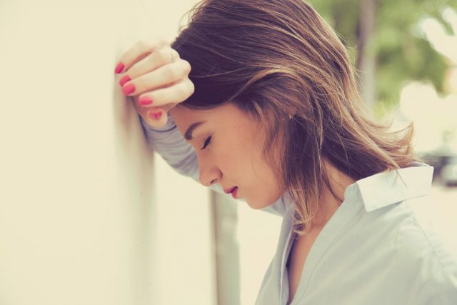 portrait stressed sad young woman outdoors