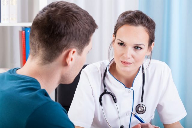 Man having medical consultation in doctor's office