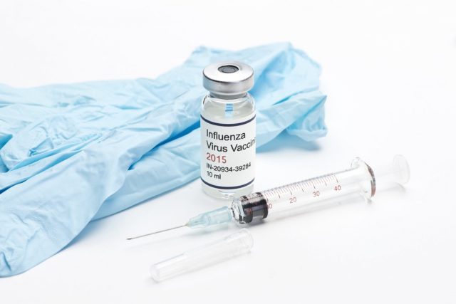 2015 Influenza flu vaccine with syringe and gloves
