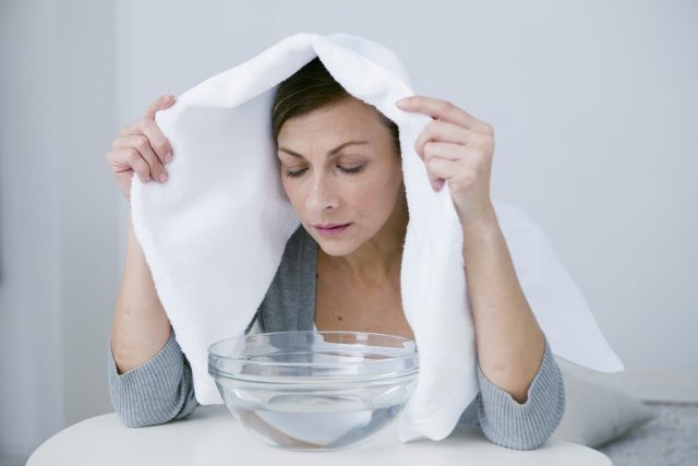 Woman Taking Inhalation