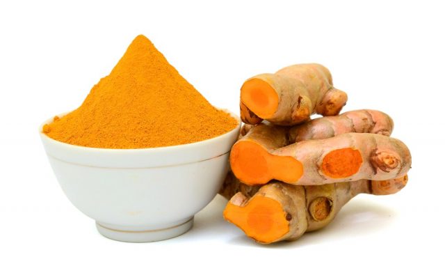 Turmeric roots with turmeric powder