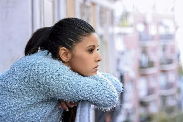 Young beautiful sad and desperate hispanic woman suffering depression