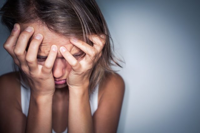 Young woman suffering from a severe depression, anxiety