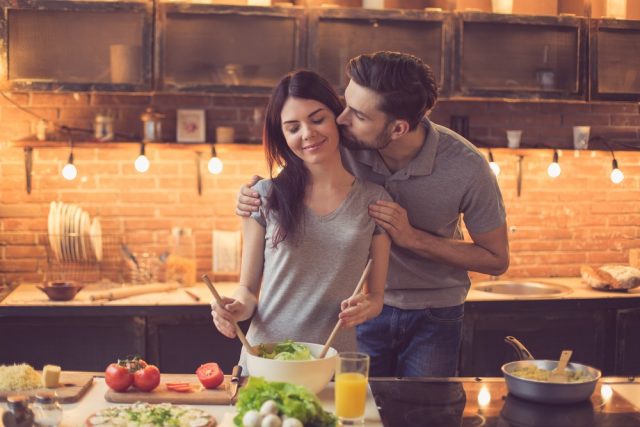 Young beautiful couple in kitchen