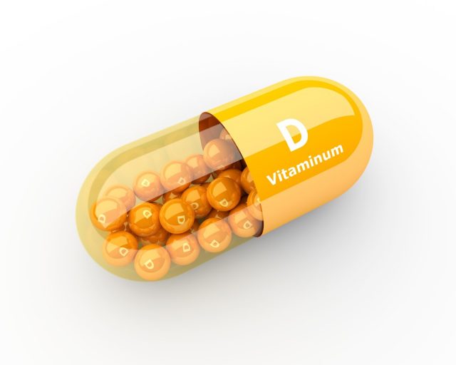 3d vitamin D capsule lying on desk