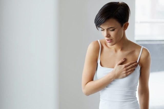 Woman Feeling Strong Pain In Chest
