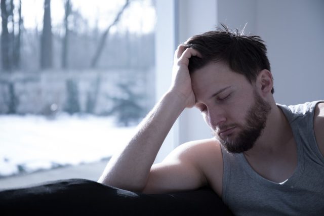 Young attractive sleepy man taking a short nap