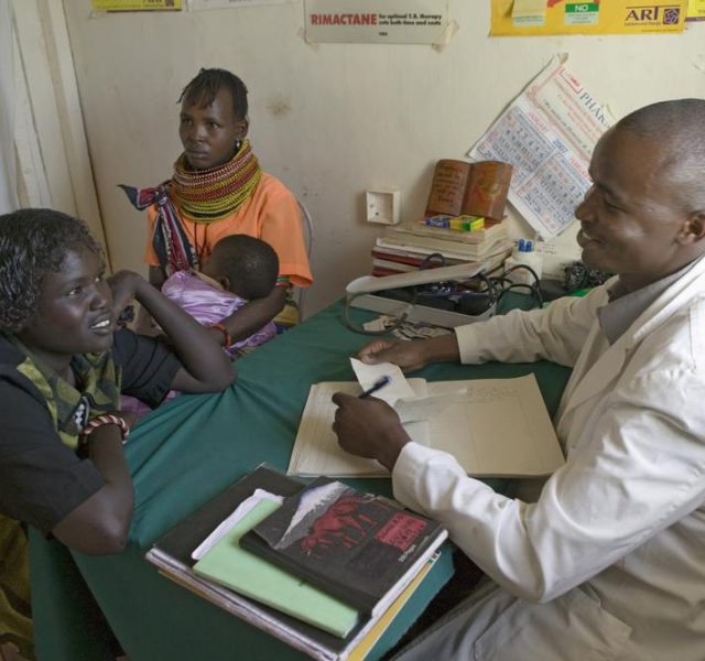 JANUARY 2007 - A doctor consults with mother and children about HIV/AIDS at Pepo La Tumaini Jangwani